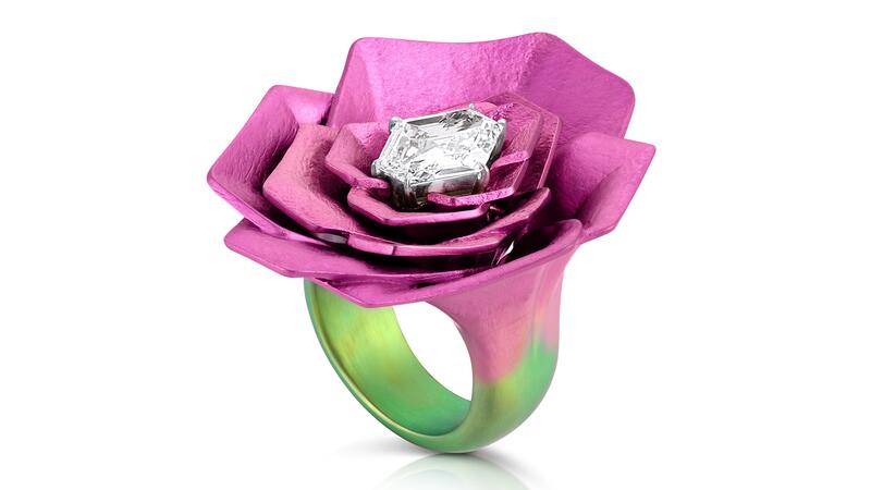 The “Camille” ring centering on a hexagonal-shaped 2.10-carat diamond set in 14-karat white gold with pink titanium petals and a green titanium band Adam Neeley Dalí’s Garden Camille Ring